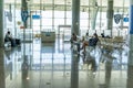 Passengers waiting inside airport boarding area  lounge Royalty Free Stock Photo