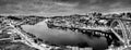 Black and white night cityscape panorama skyline of Porto old town, Luis I Bridge and river Douro banks with reflections Royalty Free Stock Photo