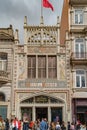 PORTO, PORTUGAL, CIRCA MARCH 2019: Crowds of tourists wait outside in line to visit the famous bookstore of Livraria Lello in Royalty Free Stock Photo