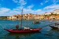 Porto, Portugal, colorful houses of Riberia district and the Douro River with traditional Rabelo boats with wine barrels Royalty Free Stock Photo