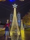 Porto, Portugal - December 9, 2023. A cozy christmas market in Batalha square, stall selling the typical handicraft and food