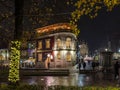 Porto, Portugal - December 9, 2023. Night scene of cordoaria garden christmas market. Residents and visitors walk the streets to Royalty Free Stock Photo