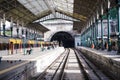 Porto, Portugal - December 2018: Sao Bento Train Station during quiet, sunny day, with commuters waiting for the train.