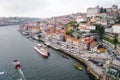 Porto, Portugal - December 2018: View of the Ribeira area and the Douro River with several tourist boats.