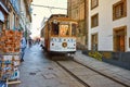 PORTO, PORTUGAL, 09, December, 2018: Wooden historical vintage street tram moving through Porto, symbol of city. Indispensable