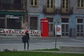 Porto, Portugal : girl in a red cap on the street near the railway station Sao Bento
