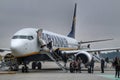 Passengers getting off the plane of Ryanair company at the Porto airport