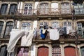 Porto, Portugal - January 20, 2020: Typical scene in urban Porto, with laundry hanging out to dry on the balcony in downtown area