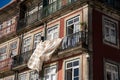 Typical scene in urban Porto, with laundry hanging out to dry on the balcony in downtown area