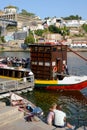 Embankment of the Douro River, resting tourists. A pair of lovers kiss on the river bank. Romantic journey