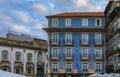 Facades of traditional houses decorated with ornate Portuguese azulejo tiles in Porto, Portugal at sunset