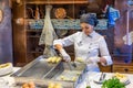 Porto, Portugal - November 15, 2017: The unidentified staff is preparing codfish cake in Casa Portuguesa do Pastel de Bacalhau, a