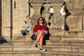 Beautiful young lady enjoying scenic old city architecture near Rio Douro in Porto