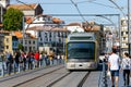 Porto, Portugal, October 06, 2018: Porto Oporto metro subway tram rain train railway rail at bridge over Douro river