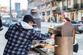 Street vendor of hot chestnuts cooked over charcoal in Porto, Portugal