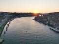 Porto, Portugal old town ribeira aerial promenade view with colorful houses, Douro river and boats. Magnificent sunset over the Royalty Free Stock Photo