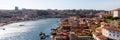 Porto, Portugal old town ribeira aerial promenade view with colorful houses, Douro river and boats Royalty Free Stock Photo