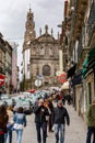 Porto,Portugal; 12/06/2016. People walk for the street whit the Clerigos Tower in back