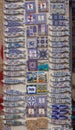 Porcelain magnets with traditional portuguese pattern azulejos. Souvenir stand on market in Porto. Ceramic blue and white gifts.