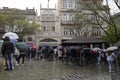 Rainy day in the city of Porto, with a huge queue of tourists to enter the Lello bookstore \