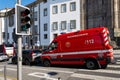 Porto, Portugal - 08/28/2019: Red ambulance stopped in the traffic