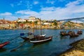 Porto, Portugal, Riberia old town cityscape with Dom Lusi bridge and the Douro River with traditional Rabelo boats