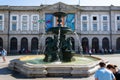 Porto, Portugal - 08/28/2019: University of Porto and lion fountain with pigeons