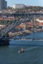 View of D. Luis bridge, with two subways to cross at the top, Douro river with boats and Vila Nova de Gaia city as background Royalty Free Stock Photo