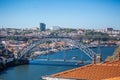 View of D. Luis bridge, with two subways to cross at the top, Douro river with boats and Vila Nova de Gaia city as background Royalty Free Stock Photo