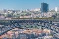 View of D. Luis bridge, with two subways to cross at the top, Douro river with boats and Vila Nova de Gaia city as background Royalty Free Stock Photo