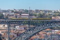 View of D. Luis bridge, with two subways to cross at the top, Douro river with boats and Vila Nova de Gaia city as background Royalty Free Stock Photo