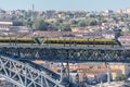 View of D. Luis bridge, with two subways to cross at the top, Douro river with boats and Vila Nova de Gaia city as background Royalty Free Stock Photo