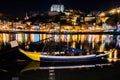 Porto, Portugal. View of the Old Town. Night cityscape. Douro river with the traditional Rabelo boats in the night the light of la Royalty Free Stock Photo