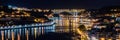 Porto, Portugal. View of the Old Town. Night cityscape. Douro river with the traditional Rabelo boats in the night the light of la Royalty Free Stock Photo