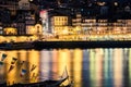 Porto, Portugal. View of the Old Town. Night cityscape. Douro river with the traditional Rabelo boats in the night the light of la Royalty Free Stock Photo