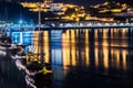 Porto, Portugal. View of the Old Town. Night cityscape. Douro river with the traditional Rabelo boats in the night the light of la Royalty Free Stock Photo