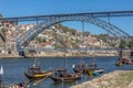 View of river Douro, with Rabelo boats on Gaia city docks, D. Luis bridge as background