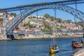 View of river Douro, with Rabelo boats, transport for Porto Wine, D. Luis bridge as background