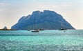 Porto San Paolo, Sardinia, Italy - Panoramic view of Isola Tavolara island seen from yacht marina of Porto San Paolo resort town Royalty Free Stock Photo