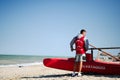 Porto Sant Elpidio, Italy - July 12, 2022: Red lifeguard rescue boat with man in italian beach Royalty Free Stock Photo