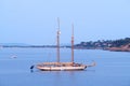 Porto Santo Stefano, Italy - August 2020: Beautiful huge sail boat with two masts anchored in the bay Royalty Free Stock Photo