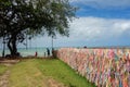 Porto Seguro, Bahia, Brazil: colorful souvenir ribbons hanging on the railing, sea on background