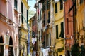 Porto Venere in Italy, typical narrow old town street with colourful houses and clotheslines