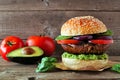 Portobello mushroom vegan burger against a dark wood background Royalty Free Stock Photo