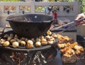 Portobello mushrooms and chicken meat fire flames background hot BBQ charcoal grill with cast-iron pot and barbecue Royalty Free Stock Photo