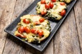 Portobello stuffed with spinach and cheese on wooden background