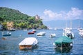 Portofino landscape, best touristic Mediterranean place with tipical colorful houses, boats and yacht in picturesque harbo