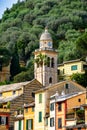 Portofino harbour clock tower in summer time ,fisherman village , touristic season