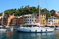 PORTOFINO, ITALY - JUNE 13, 2017: The beautiful Portofino panorama with colorful houses, luxury boats and yacht in little bay harb
