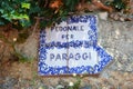 PORTOFINO, ITALY - JUNE 13, 2017: ceramic sign Pedonale per Paraggi, the walking trail on the cliff from Portofino to Paraggi